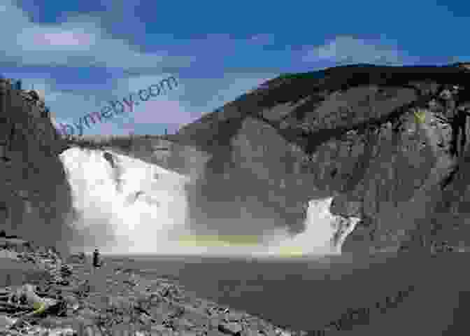 A Breathtaking View Of Nahanni National Park, Featuring The Mighty Virginia Falls And The Winding South Nahanni River. Canadian National Parks: World Tour