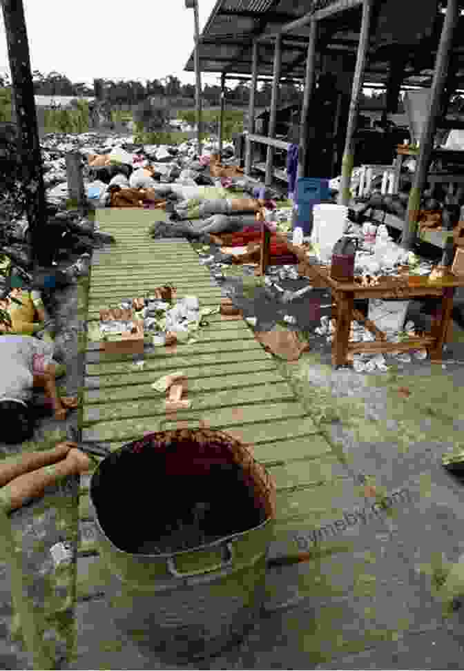 A Haunting Image Of The Aftermath Of The Jonestown Tragedy, With Bodies Lying On The Ground In A Mass Grave. Raven: The Untold Story Of The Rev Jim Jones And His People