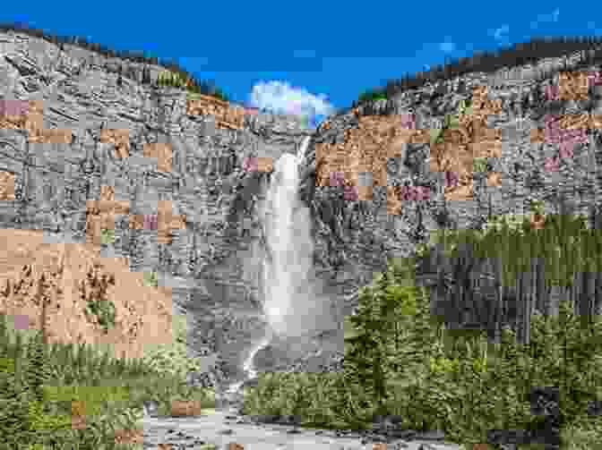 A Stunning View Of Yoho National Park, Showcasing The Towering Takakkaw Falls Cascading Down The Sheer Cliffs. Canadian National Parks: World Tour