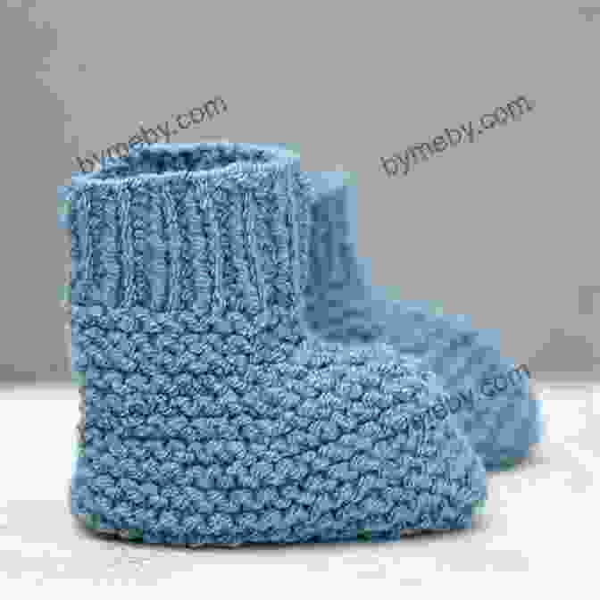 Knitted Baby Booties In Soft White Yarn With Ribbed Cuff And Baby Foot Toe Design. Knitting Pattern KP195 Baby Jacket Hat And Booties 0 3mths UK Terminology