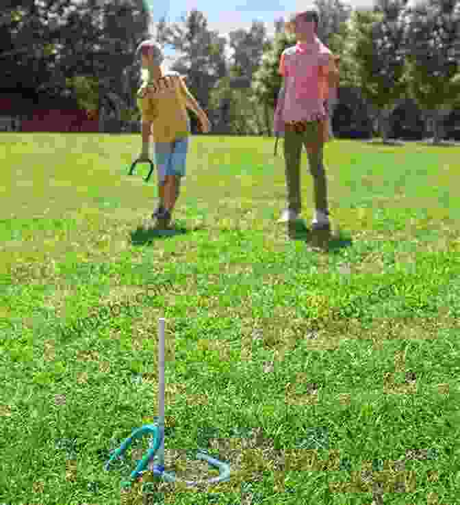 Two Players In A Friendly Game Of Horseshoes, Aiming To Toss Their Horseshoes Around A Stake TM 21 220 Sports And Games 1942: Topics: Badminton Baseball Basketball Bowling Boxing Handball Horseshoes Soccer Softball Speedball Table Tennis Tennis Touch Football Track And Field